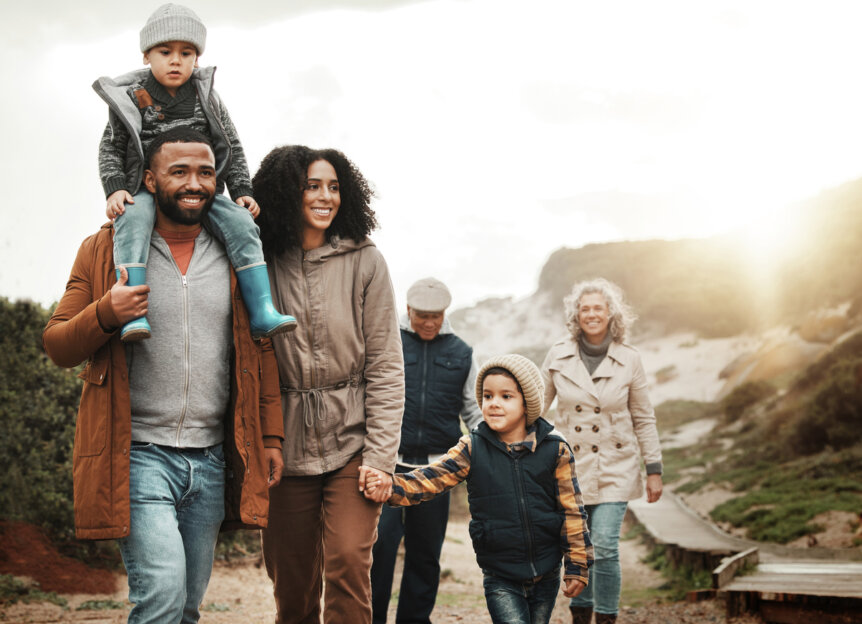 Military family walking outdoors, symbolizing support, planning, and deployment readiness.