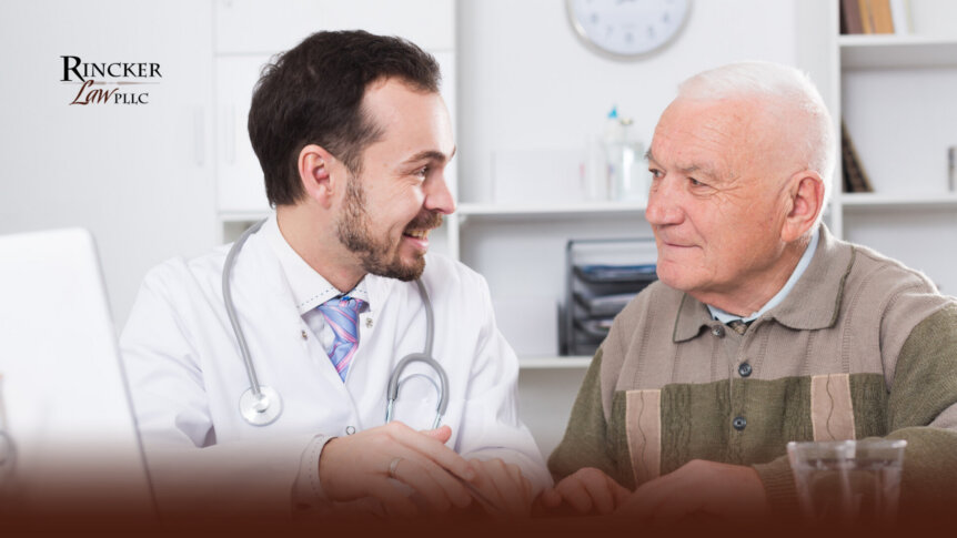 A doctor speaking with an older adult about medical decisions and future planning.